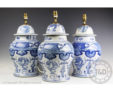 Three modern blue and white table lamps, modelled as vases and covers in the Chinese Kangxi style, 46cm high (3)Provenance: Y
