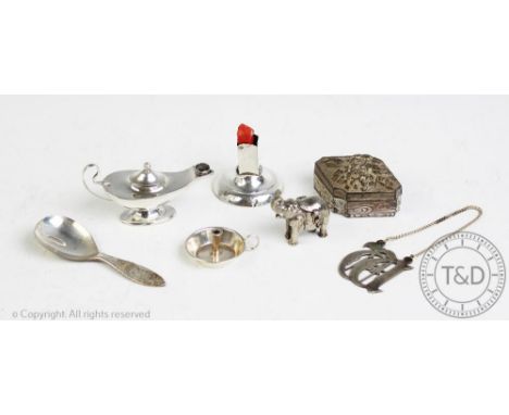 A selection of silver items, to include, a table lighter in the form of a genie's lamp, a miniature chamber stick, a sealing 