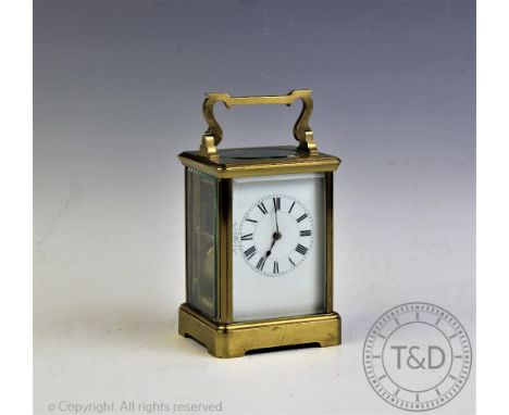 A 19th century French carriage clock, the lacquered brass rectangular case set with beveled glass enclosing a white enamel fa