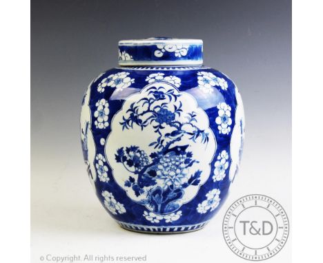 A large Chinese porcelain blue and white ginger jar, Kangxi character mark, late 19th century, the ovoid shaped jar decorated