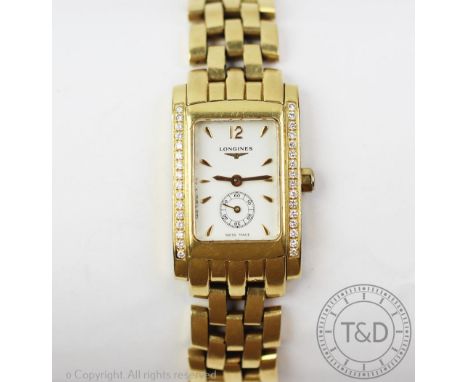 A ladies Longines 18ct yellow gold Dolce Vita wristwatch, the rectangular case, diamond set, enclosing white enamel dial with