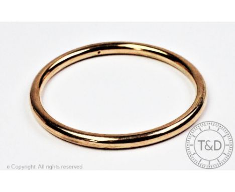 A 9ct yellow gold Smith and Pepper 'slave' bangle, of plain polished, simple design, stamped '9ct S&amp;P Wax Filled', 7cm in