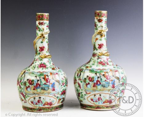 A pair of 19th century Chinese porcelain, Canton famille rose bottle vases, the slender necks wrapped with a scaly dragon, ab