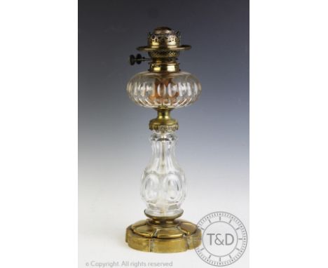 A Victorian cut glass oil lamp, with faceted reservoir and column, on brass base, 45cm high CONDITION REPORT: Lighting lots a