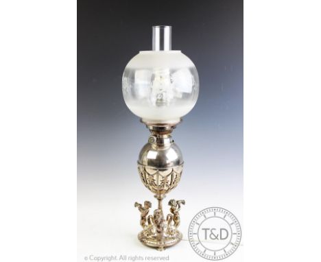 An Elkington & Co silver plated oil lamp, designed on a circular base with three sea nymphs blowing cornucopia horns, the aca