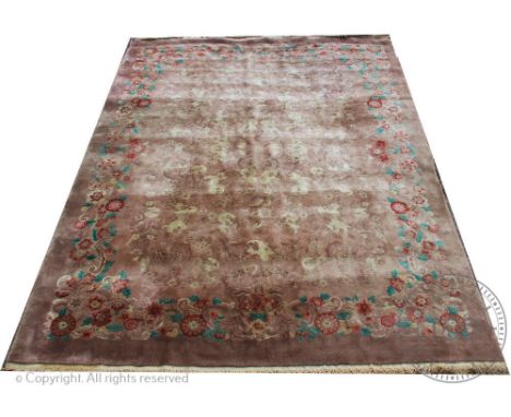 A Chinese carpet, worked with a floral design against a beige ground, 348cm x 273cmProvenance: Yeaton Peverey Hall