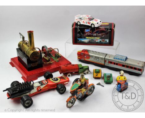 A Mamod Steam Plant model, 22cm high, a Japanese tinplate clockwork motorcycle and side car, 9.5cm high, a Santa Fe train, 35