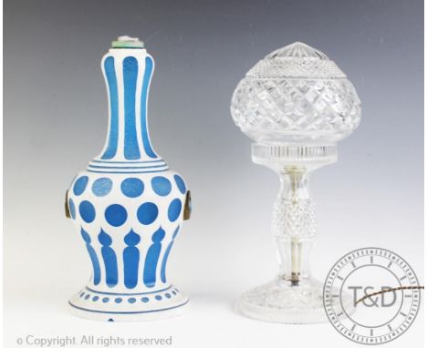An Armand Marseille mould 351 bisque head doll, with a cut glass table lamp and shade, 32cm high and a opaque glass lamp (the