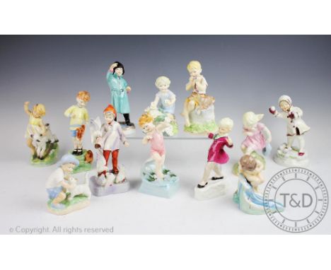 A set of twelve Freda Doughty for Royal Worcester months of the year figures, January through to December, tallest 19cm high 