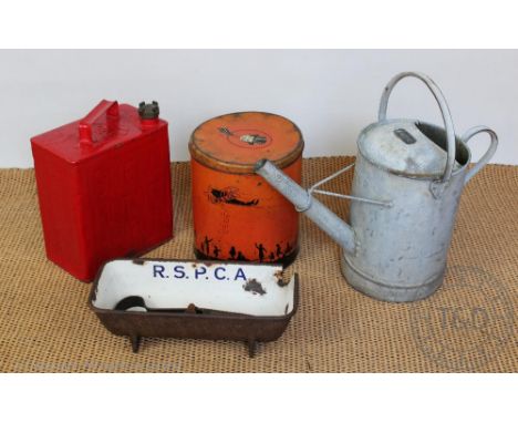 A Great Western Railway watering can, with a Shell Motor Spirit petol can and cap, an RSPCA cast iron trough, various tins an