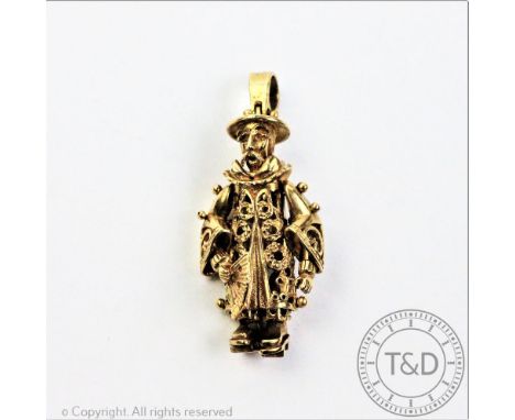 A 9ct yellow gold 'Chinaman' pendant, of articulated form, modelled holding a fan, gross weight 15gms, 4.5cm long  