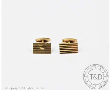 A pair of 9ct gold cufflinks, each designed as a rectangular panel with stripe detail and swivel 'stop', gross weight 7.6gms 