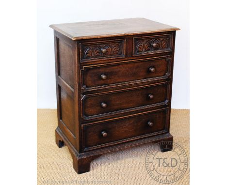 An oak chest, with two short and three long drawers, on bracket feet, 92cm H x 76cm W x 50cm D, with a pole screen and a lect