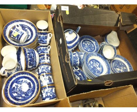 TWO BOXES OF BLUE AND WHITE WILLOW PATTERN CHINA TO INCLUDE A TEAPOT, CUPS AND SAUCERS ETC