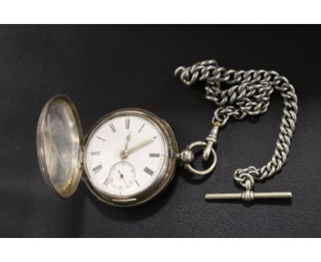 A HALLMARKED SILVER MANUAL WIND FULL HUNTER POCKET WATCH ON GRADUATING SILVER PLATED CHAIN AND T-BAR