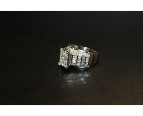 A 14 CARAT WHITE GOLD DIAMOND RING SET WITH AN ESTIMATED 3.5 CARATS OF DIAMONDS RING SIZE O APPROX WEIGHT 10G