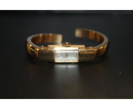 A LADIES 18 CARAT GOLD BANGLE BRACELET FLUVA WRIST WATCH, APPROX WEIGHT 15.3G