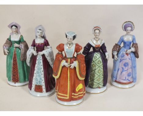 FIVE CERAMIC FIGURES OF THE WIVES OF KING HENRY VIII, COMPRISING ANNE BOLEYN, ANN OF CLEVES, CATHERINE OF ARAGON, CATHERINE H