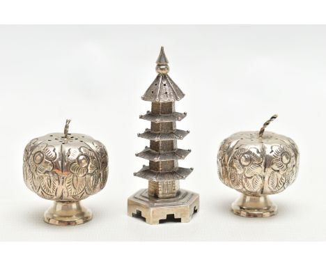 THREE NOVELTY WHITE METAL PEPPERETTES, to include a pair of pumpkin style pepperettes, with floral detailing, slightly raised