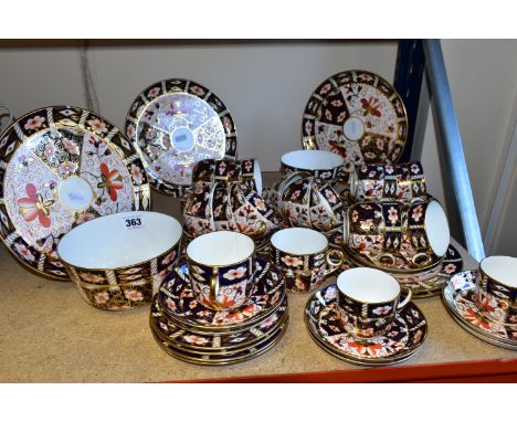 A GROUP OF ROYAL CROWN DERBY IMARI 2451 PATTERN TEA WARE, comprising three plates date codes 1921 and 1912, diameter 23cm, on