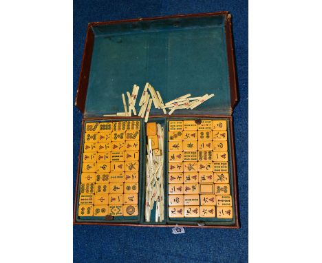 A LEATHER CASED MAHJONG SET, with bone and plastic pieces in fixed and pull out trays, case approximate length 35cm x width 2