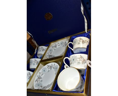 A PRESENTATION BOXED SET OF COALPORT 'MY FAIR LADY' PATTERN TEA CUPS AND SAUCERS, comprising six cups (one cracked) and six s