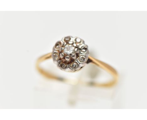 A YELLOW METAL DIAMOND FLOWER RING, set with nine round brilliant cut diamonds, estimated total diamond weight 0.40cts, pinch
