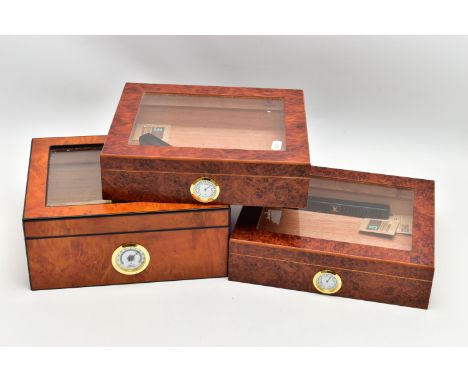 THREE 'GERMANUS' AMBOYNA CIGAR HUMIDOR BOXES, two shallow wooden boxes with an open top glass panel, fitted with a hygrometer