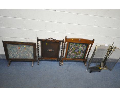A BRASS UPRIGHT COMPANION SET, along with a folding fire screen, three oak fire screens, two small cast iron fire grates, etc