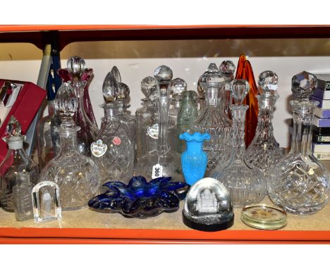 A LARGE QUANTITY OF CUT CRYSTAL DECANTERS AND COLOURED GLASS, comprising a purple ribbed vase (possibly Val St. Lambert), hei