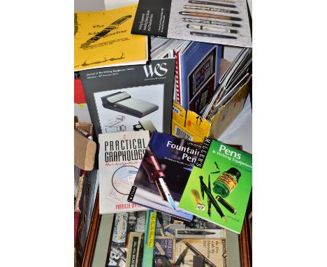 A DISPLAY OF VINTAGE PENS AND TWO BOXES OF BOOKS AND MAGAZINES, comprising a wall mounting wooden display case containing fou
