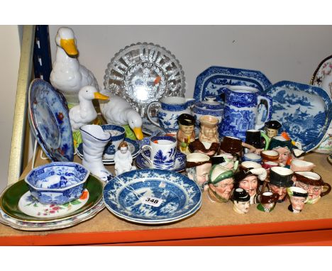 A GROUP OF BLUE AND WHITE CERAMICS AND MINIATURE CHARACTER JUGS, comprising three 19th century Turner 'Willow' pattern dishes