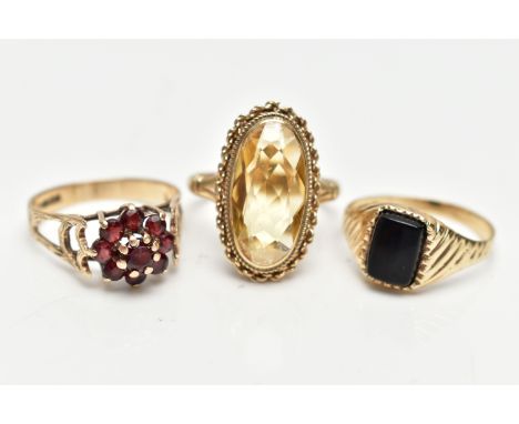 THREE 9CT GOLD RINGS, the first a yellow gold signet ring, set with a rectangular cut onyx stone, leading onto a tapered text