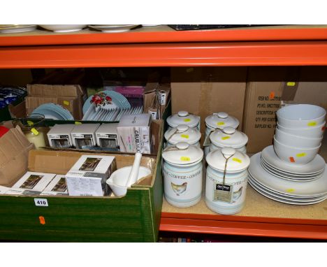 FOUR BOXES OF NEW AND UNUSED KITCHEN WARES, to include 'Studio' white dinner ware comprising four dinner plates, four side pl