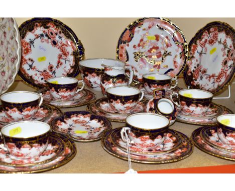 A ROYAL CROWN DERBY 5852 IMARI WARE TEA SET, comprising one milk jug, one slop bowl, two bread and butter plates, eight cups 