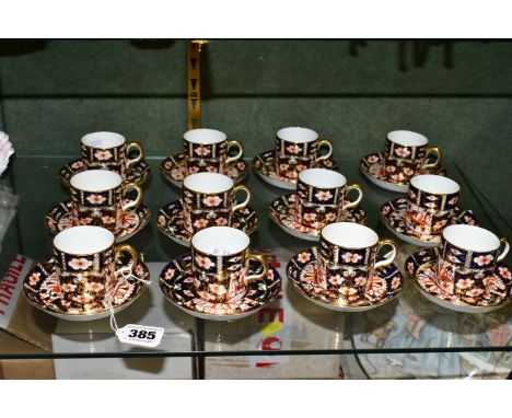 TWELVE ROYAL CROWN DERBY COFFEE CANS AND SAUCERS, in the Traditional Imari 2451 pattern, each with red printed backstamp and 