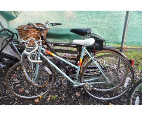 TWO LADIES BICYCLES comprising of a Raleigh Cameo in maroon with 3 speed gears, basket and 21in frame along with a vintage Pe