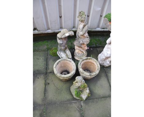 FIVE COMPOSITE GARDEN ORNAMENTS comprising of a kneeling female figure 50cm high, a seated female figure 68cm high, two plant