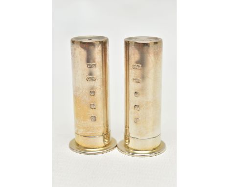 A PAIR OF MODERN SILVER PEPPERETTES, each in the form of a polished shot gun case, stamped to the base '1212', hallmarked 'WW