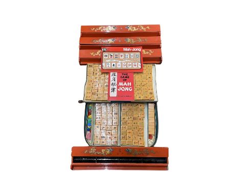 A vintage cased Mah Jong set, with 4 wooden tile stands emblazoned with dragons