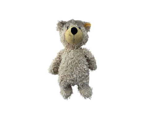 A Steiff teddy bear, with yellow tag and gold ear button