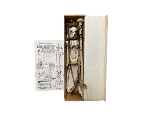 An SL Skeleton Pelham puppet with original box, instructions and spare hand piece.