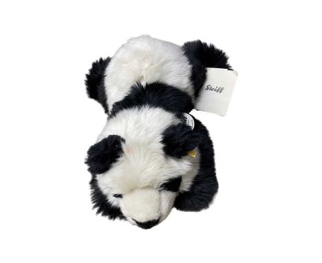 A modern Steiff Original Manschli panda, with gold button/ear tag and original retail tags.