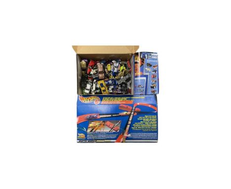 A boxed Mattel Hotwheels Starter set, with a collection of loose vehicles