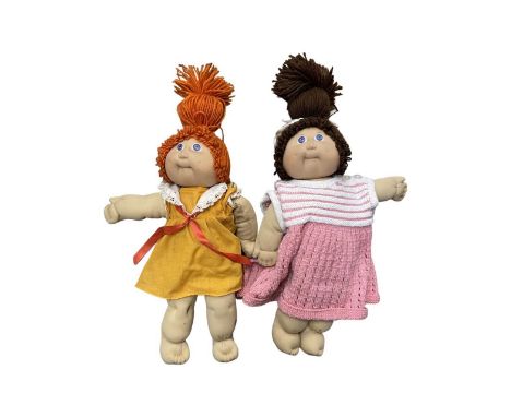 A pair of 1980s Cabbage Patch dolls, with printed signature of Xavier Roberts. AF