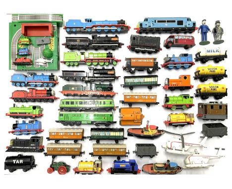 A collection of die-cast Thomas the Tank Engine trains and vehicles by ERTL