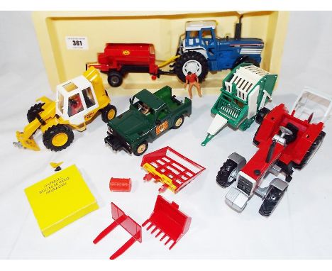 Britains - a battery operated Tractor and Trailer # 9381 and other Britains farm vehicles and accessories
