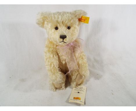 A Steiff mohair bear, button in ear with tag labels, blond, 27 cm (h). Estimate £30 - £50