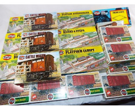 Model railways - a quantity of HO/OO scale boxed scenics and rolling stock kits comprising six Airfix station buildings and s