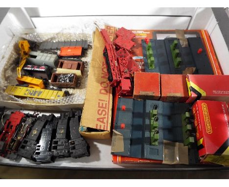 Model Railways - a box containing a good mixed lot of OO gauge goods wagons, a Lima car transporter with cars, a Hornby Dublo
